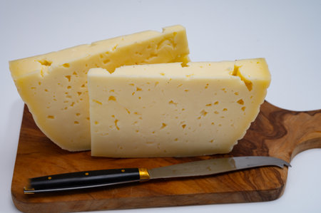 Fresh Asiago cow's milk cheese, produced in Asiago in Italy, different textures according to its aging, used in panini, sandwiches, melted on variety of dishes, classified Swiss-type Alpine cheeseの写真素材