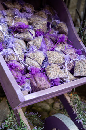 Small violet bags with aromatic seeds of lavender plant on market in Provence, close upの写真素材