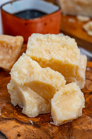 Tasting of 24 and 48 months aged in caves Italian parmesan hard cheese from Parmigiano-Reggiano, Italy and balsamic vinegar from Modenaの写真素材