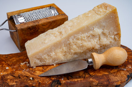 Traditional italian food - 24 months aged in caves Italian parmesan hard cheese from Parmigiano-Reggiano, Italyの写真素材