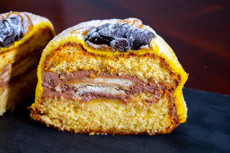 Polenta e Osei di Bergamo Alta most renowned sweet specialty of Bergamo's cuisine, made from sponge cake, chocolate, butter, hazelnut creams and rumの写真素材