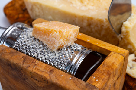 Traditional italian food - 24 months aged in caves Italian parmesan hard cheese from Parmigiano-Reggiano, Italyの写真素材