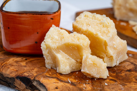 Tasting of 24 and 48 months aged in caves Italian parmesan hard cheese from Parmigiano-Reggiano, Italy and balsamic vinegar from Modenaの写真素材