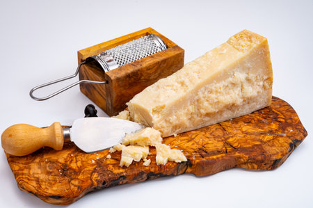 Traditional italian food - 24 months aged in caves Italian parmesan hard cheese from Parmigiano-Reggiano, Italyの写真素材