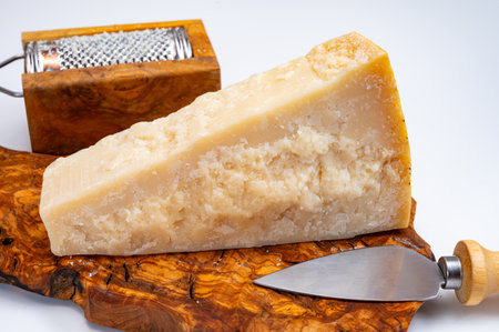 Traditional italian food - 24 months aged in caves Italian parmesan hard cheese from Parmigiano-Reggiano, Italyの写真素材