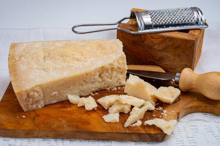 Traditional italian food - 24 months aged in caves Italian parmesan hard cheese from Parmigiano-Reggiano, Italyの写真素材