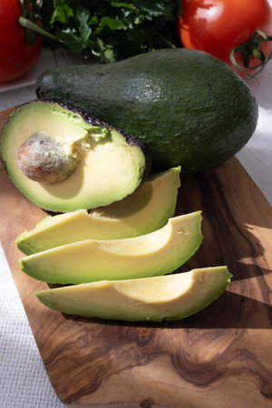 Ripe green organic avocados ready to eat, on table, Fuerteventura, Canary islands, Spainの写真素材