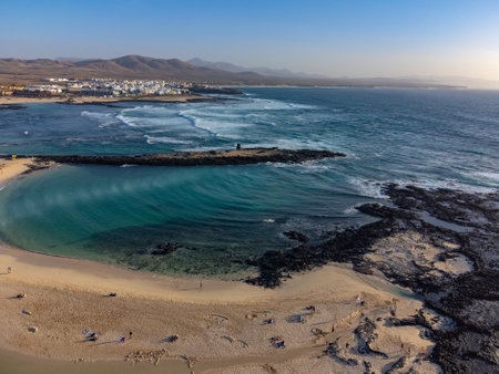 West coast of Fuerteventura island. Winter sea and sun vacation in El Cotillo touristic village, Canary islands, Spain on white sandy beach La Concha.の写真素材