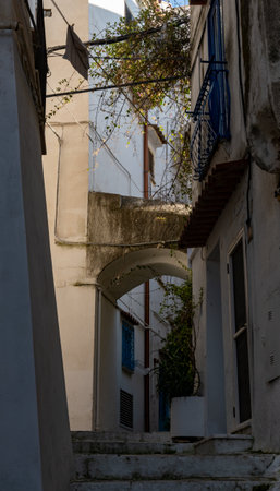 White old houses and narrow streets in medieval small touristic coastal town Sperlonga, Latina, vacation in Italy, winterの写真素材