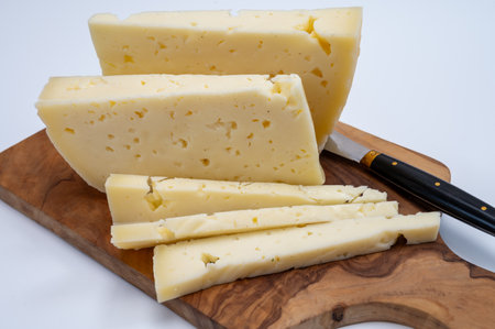 Fresh Asiago cow's milk cheese, produced in Asiago in Italy, different textures according to its aging, used in panini, sandwiches, melted on variety of dishes, classified Swiss-type Alpine cheeseの写真素材