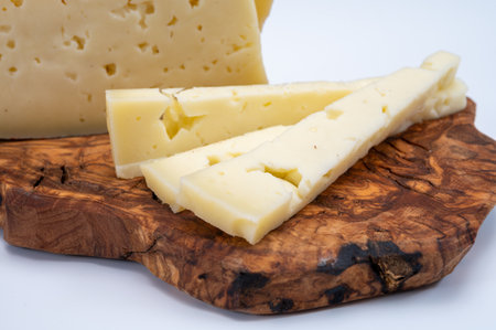 Fresh Asiago cow's milk cheese, produced in Asiago in Italy, different textures according to its aging, used in panini, sandwiches, melted on variety of dishes, classified Swiss-type Alpine cheeseの写真素材