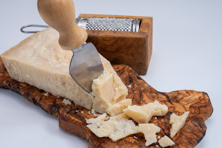 Traditional italian food - 24 months aged in caves Italian parmesan hard cheese from Parmigiano-Reggiano, Italyの写真素材