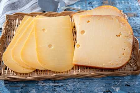 Cheese collection, Dutch ripe hard cheese made from cow milk in the Netherlands in piece and sliced close upの写真素材