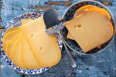Cheese collection, Dutch ripe hard cheese made from cow milk in the Netherlands in piece and sliced close upの写真素材