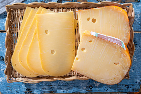 Cheese collection, Dutch ripe hard cheese made from cow milk in the Netherlands in piece and sliced close upの写真素材