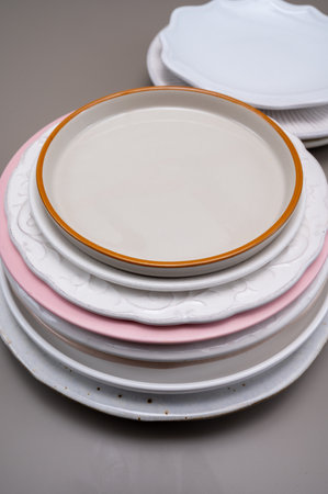 Stack of different ceramic or porcelain trendy dinner platesの写真素材