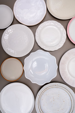 Variety of white ceramic or porcelain trendy plates flat lay copy spaceの写真素材