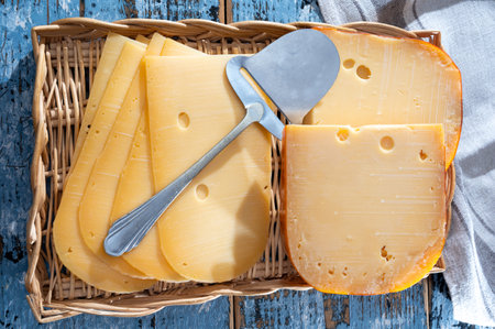 Cheese collection, Dutch ripe hard cheese made from cow milk in the Netherlands in piece and sliced close upの写真素材