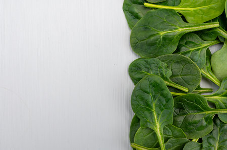 Fresh green baby Spinach leaves, diet and healthy food concept, weight loss, spinach background top view copy spaceの写真素材