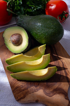 Ripe green organic avocados ready to eat, on table, Fuerteventura, Canary islands, Spainの写真素材