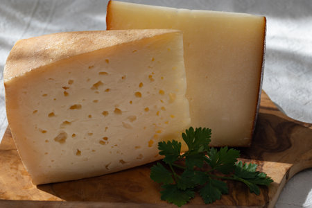 Spanish hard manchego, cow, sheep and goat cheese close upの写真素材