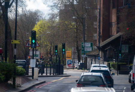 Transportation in London city, roads, road signes, street signs, different warnings, indicating of directions in Great Britain, city life in Englandの写真素材