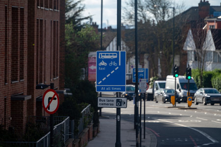 Transportation in London city, roads, road signes, street signs, different warnings, indicating of directions in Great Britain, city life in Englandの写真素材