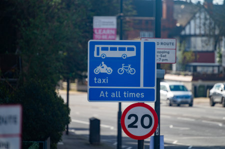Transportation in London city, roads, road signes, street signs, different warnings, indicating of directions in Great Britain, city life in Englandの写真素材
