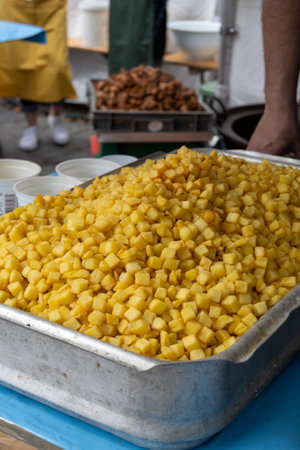 Garnish to meat, fried potato in cubes on local market, served for lunch buffet in big alu trayの写真素材