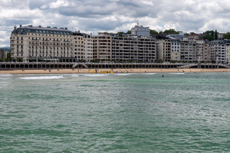 Elegant downtown, La Concha sandy beach in famous San Sebastian or Donostia city, touristic destination in north of Spainの写真素材