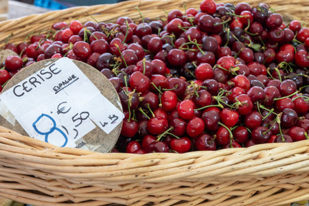 New season of ripe red sweet cherry summer fruits, cherry for sale on farmers market in Spain, translation: cherry from Spain and priceの写真素材