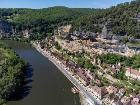 Aerial view on Dordogne river in La Roque-Gageac rocky village located in Dordogne department in southwestern Franceの写真素材