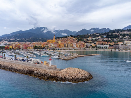Aerial view on French Riviera, colorful Menton old city and marina on blue Mediterranean Sea near French-Italian border, travel destination, panoramic view from aboveの写真素材
