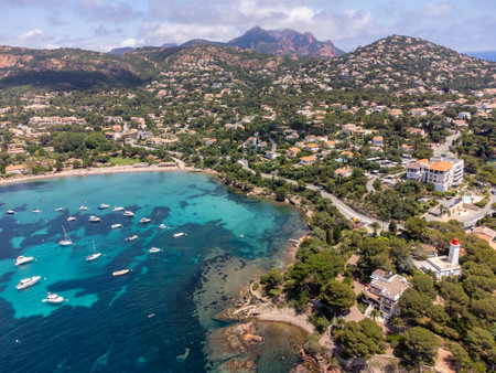 Panoramic view from above on blue Mediterranean dea, sandy beach of Agay town, summer vacation destination near Esterel red mountains, French Riviera, Provence. Franceの写真素材