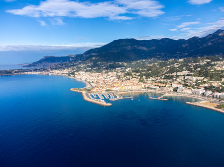 Aerial view on French Riviera, Menton, mountains and Mediterranean Sea as seen from French-Italian border in Grimaldi village, Ventimiglia, travel destination, panoramic view from aboveの写真素材