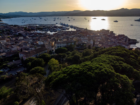 Aerial view on bay, hills, old citadel fort, colorful houses of famous Saint-Tropez town on French Riviera at sunset, Var, Provence, France, summer vacation destinationの写真素材