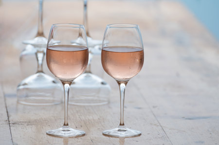 Summer time in Provence, two glasses of cold rose wine with blue sea view on background, French Riviera near Menton and Monaco, south of Franceの写真素材