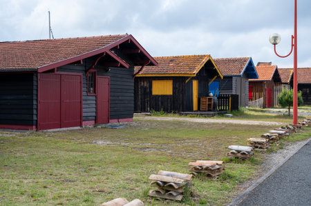 Traveling in France, old wooden huts and oysters farms in Gujan-Mestras village, cultivation, fishing and sale of fresh oysters seashells, Arcachon bay, Atlantic ocean, France, tourists destinationの写真素材