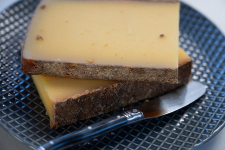 French yellow cheese Comte, varieties unpasteurized cow milk Prestige, fruity flavored and Vieille Reserve close upの写真素材