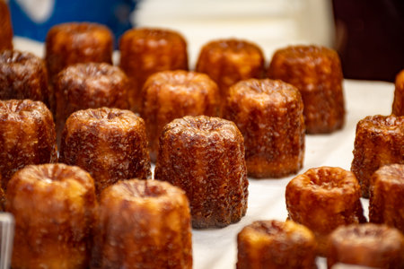 Baked Canele, French pastry flavored with rum and vanilla, specialty of Bordeaux region, Franceの写真素材