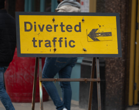 Transportation in London city, roads, road signes, street signs, different warnings, indicating of directions in Great Britain, city life in Englandの写真素材