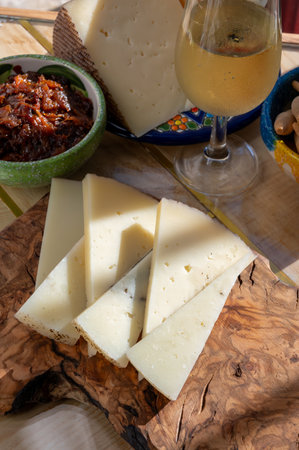 Sherry fino wine and food pairing, Spanish matured cheese and onion chutney close up, Jerez de la Frontera, Andalusia, Spainの写真素材