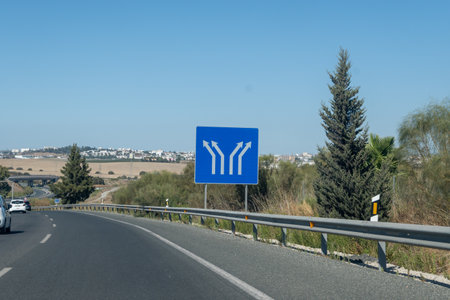 Driving car or family camper in summer, road signs and directions Sevilla, Jerez, Cadiz, no traffic jam on touristic road in Andalusia, Spainの写真素材