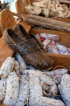 Variety of homemade dried salami sausages in butchery shop, Dordogne, France, pork meat food background close upの写真素材