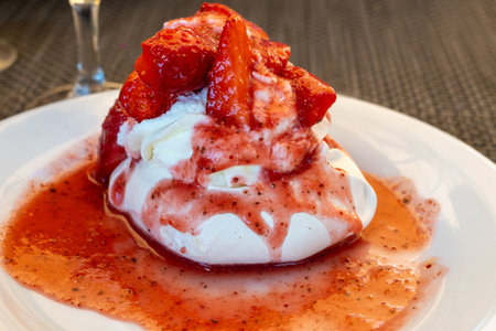 Sweet french dessert, Red strawberry fruit pavlova served in restaurant in Saint-Tropez, France, close upの写真素材