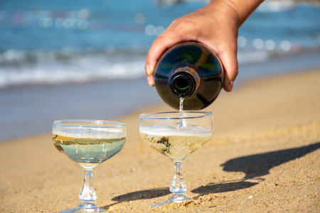 Summer time on French Riviera, two coupe glasses of champagne cremant sparkling wine on Pampelonne sandy beach near Saint-Tropez in sunny day, Var department, vacation in Franceの写真素材