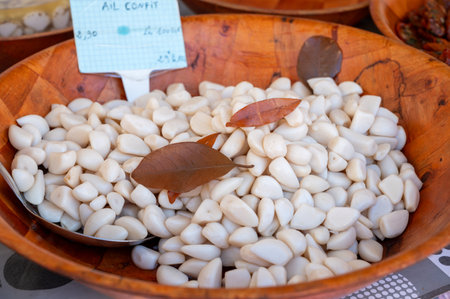 Pickled marinated white garlic heads in pieces on local farmers market in Franceの写真素材