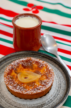 Basques bio food, sheep's milk curd dessert Mamia or Cuajada, Curd, maman, gatzatua or gaztanbera Original Basque Dessert curdled with rennet and homemade pears cakeの写真素材