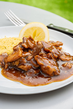 Meat dish Caramel pork served with couscous close upの写真素材