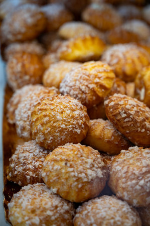 Many Chouquettes or petits choux are small pieces French patisserie consisting of small spheres of choux pastry, sugared and baked, Bordeaux, Franceの写真素材
